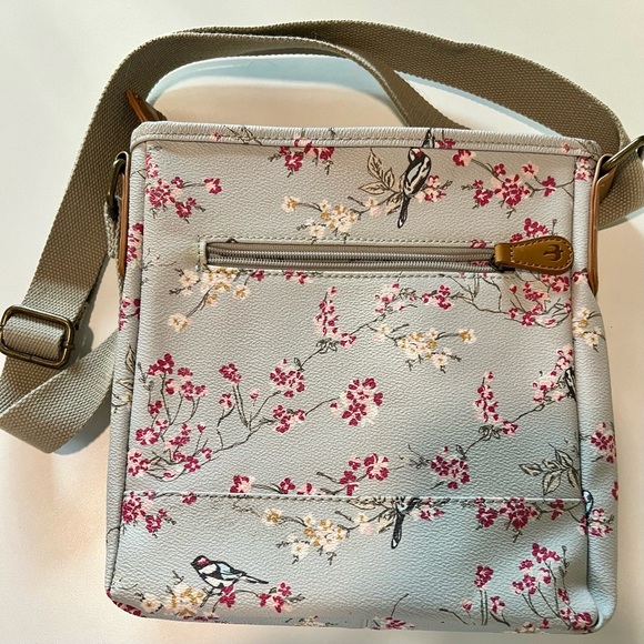 Brakeburn robin’s egg blue/gray cross body with a bird and a pink floral motif. - Picture 2 of 6